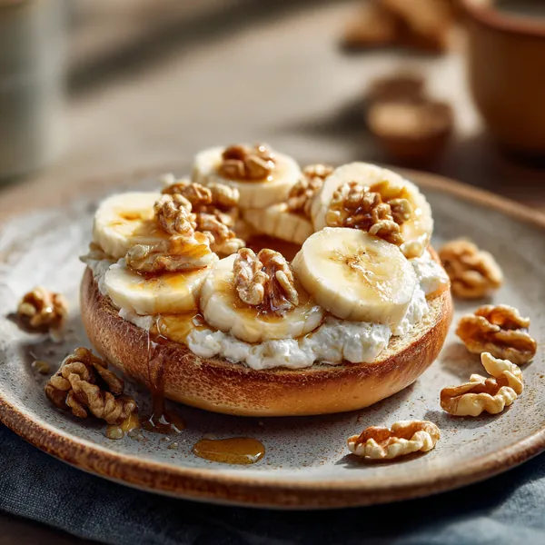 5 Healthy High-Protein Bagel Toppings That Actually Keep You Full 19 close-up of bagel toppings featuring banana, walnuts, ricotta, and maple syrup