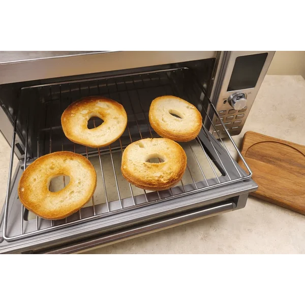 5 Healthy High-Protein Bagel Toppings That Actually Keep You Full 21 toasted bagel halves in toaster oven ready for toppings