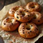Cinnamon Raisin Bagel: Easy, High Protein. You’ll Love It 6 Cinnamon raisin bagels freshly baked on a rack