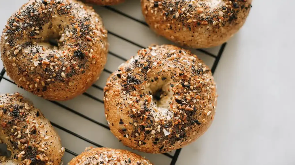Everything Bagel You’ll Love, Easy, Homemade & High Protein 11 close-up of golden everything bagel topped with sesame, poppy seeds, and garlic on