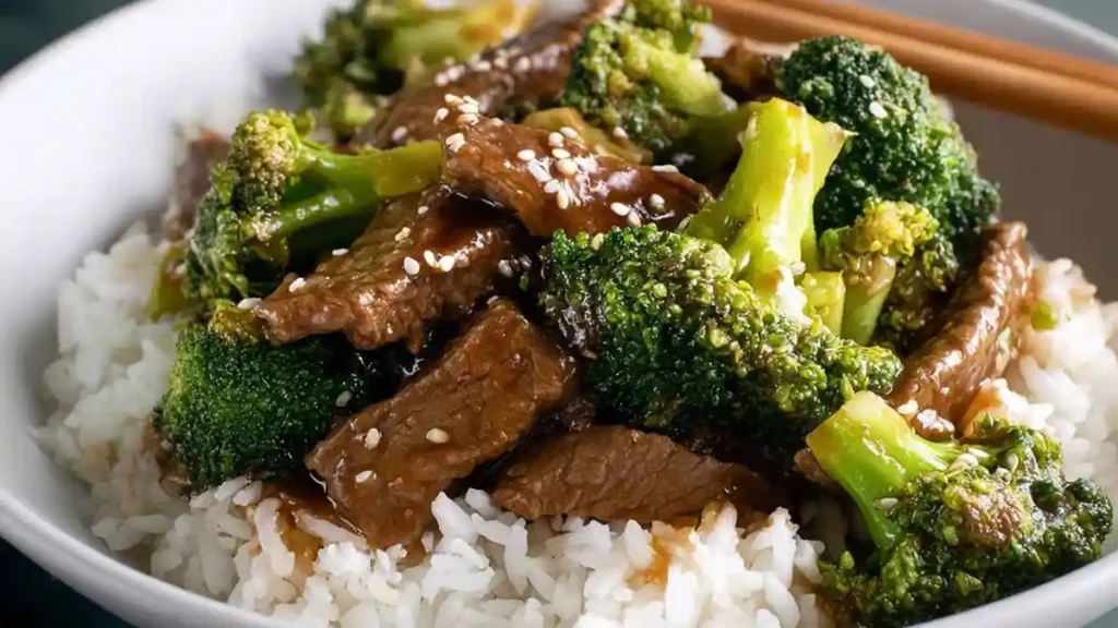 Chinese Beef and Broccoli 5 juicy beef slices with broccoli and sesame seeds over white rice