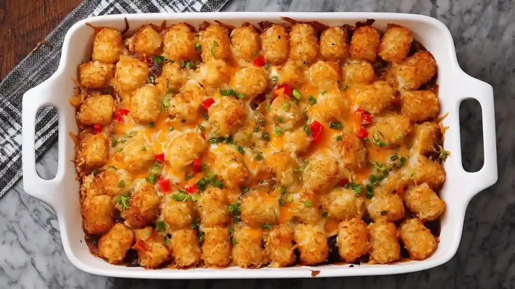 Cheesy Beefy Tater Tot Casserole 4 golden tater tot casserole with melted cheese and peppers