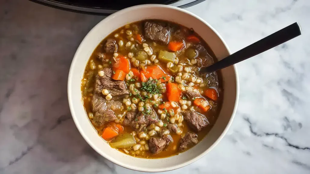 Slow Cooker Beef Barley Soup 5 hearty beef barley soup with chunks of beef, carrots, celery, and fresh herbs