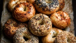 assorted artisan Homemade Protein bagels with mixed seeds and toppings on parchment paper