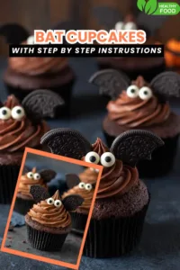 chocolate cupcakes with Oreo bat wings and candy eyes on dark table