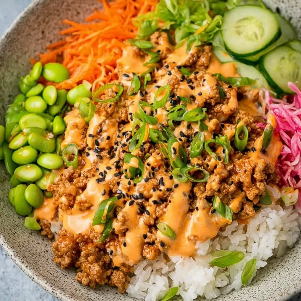 Home 6 Ground turkey rice bowl with Bang Bang sauce on a plate