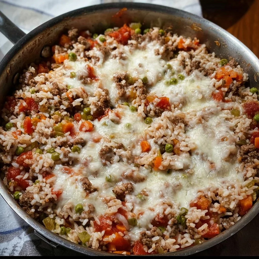 High-Protein Italian beef rice skillet served in a pan with fresh ingredients.