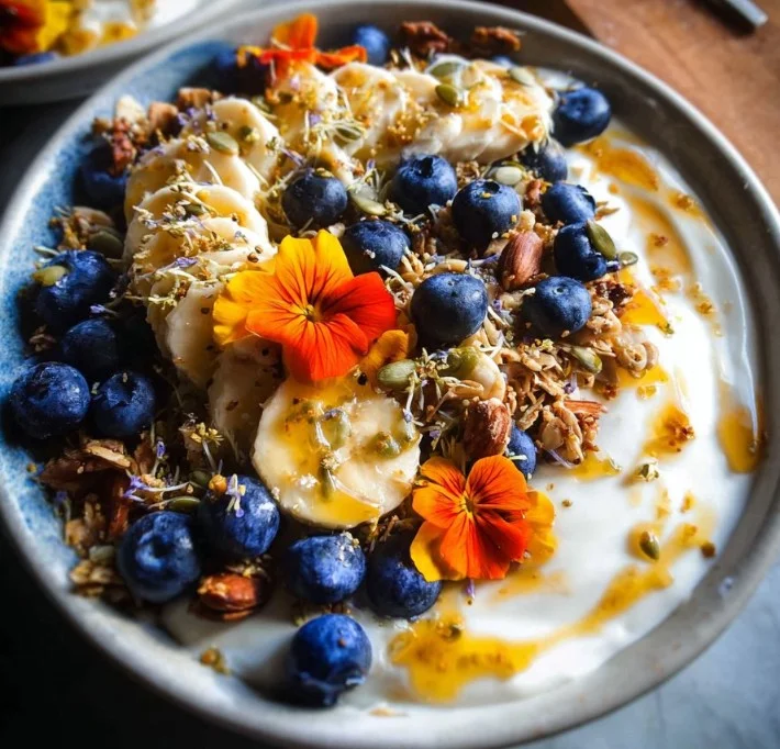 Blueberry muffin granola breakfast bowl with Greek yogurt and fresh blueberries