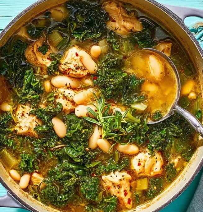 Delicious Chicken and Kale Soup in a bowl with fresh ingredients