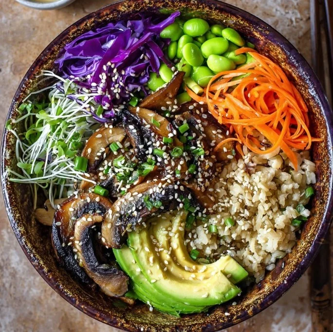 Miso ginger rice bowl garnished with fresh herbs and vegetables