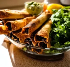 Baked black bean taquitos arranged on a plate for a delicious vegetarian meal.
