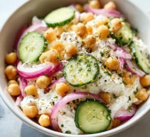 Cottage cheese chickpea salad bowl with fresh vegetables for a quick meal