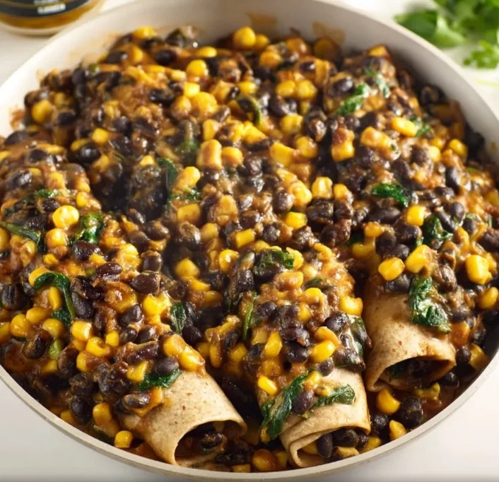 Delicious crispy black bean burritos served on a plate with salsa