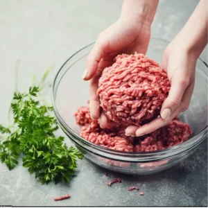 Delicious crispy ground beef dinner served with vegetables and herbs