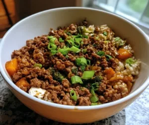 Ground Beef Hot Honey Bowl topped with vegetables and drizzled with hot honey
