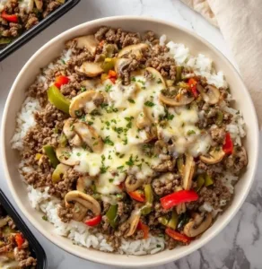 Delicious Ground Beef Philly Cheesesteak topped with melted cheese and peppers