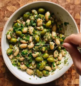 Tangy green olive bean salad with fresh ingredients and vibrant flavors
