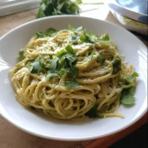 Delicious Poblano Verde Spaghetti garnished with fresh herbs