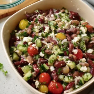 High protein kidney bean salad served in a bowl with fresh vegetables