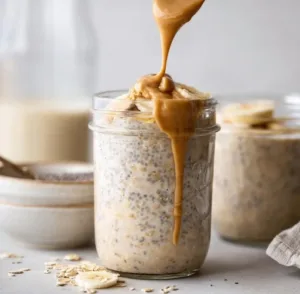 Delicious and nutritious high-protein PB overnight oats served in a bowl.